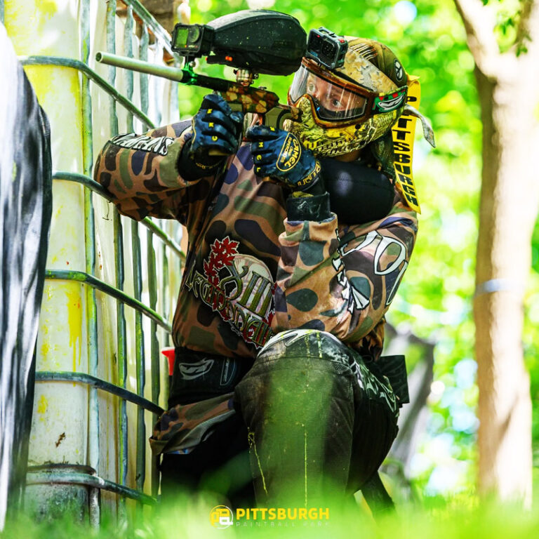 A paintball player is in action having custom paintball jersey from custompantball.co in the Pittsburgh paintball park